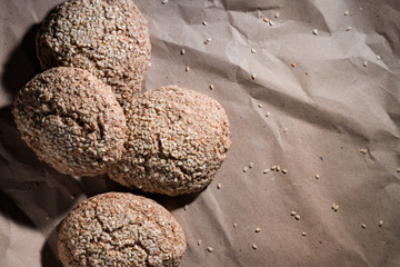 Homemade Gluten Free Bread. green buckwheat flour bread with sesame on craft paper. Place for text. concept healthy food