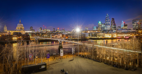 Millennium Bridge London with St. Paul's cathedral at night