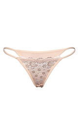 Subject shot of a creamy lace thong with thin side straps and flowers tracery. The sexy panties are...