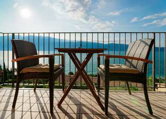 Terrace with table and chairs with view in Garda Lake in Gargnano in Italy