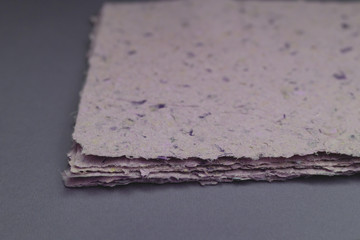 Handmade paper. A stack of texture paper. Concept of recycling used paper, ecology theme.