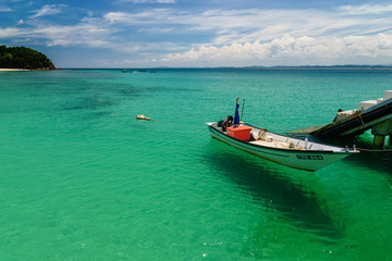 Fototapeta na wymiar A boat at Pulau Kapas jetty