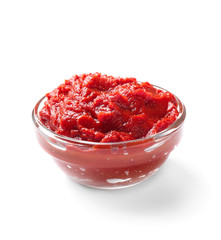 Bowl with tomato sauce on white background