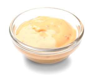 Bowl with tasty sauce on white background