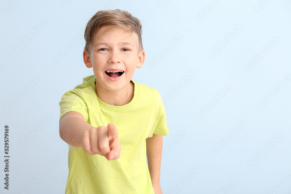 Sticker happy little boy pointing at viewer on white background