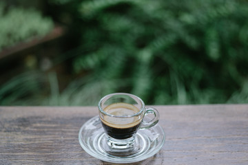 up of espresso coffee on wooden table background