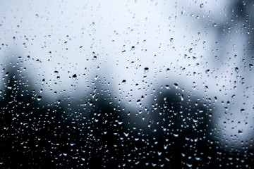 Naklejka na ściany i meble rain drops in a window