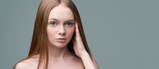 Naklejka premium Young pretty woman studio portrait. Cosmetology concept. Esthetic woman face. Skin care dermatology beauty contour. Harmony girl. For cream, lotion horizontal banner. Copyspace