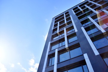 Obraz premium Modern office building facade abstract fragment, shiny windows in steel structure