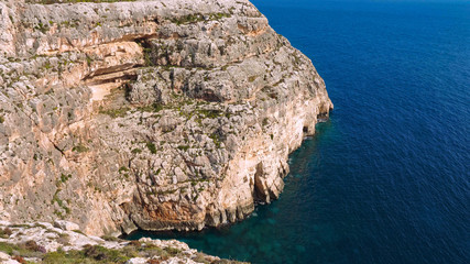 Fototapeta na wymiar Amazing blue water at Blue Grotto on Malta - travel photography