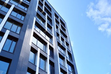 Modern office building facade abstract fragment, shiny windows in steel structure