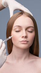 Young pretty woman studio portrait. Cosmetology biorevitalization concept. Esthetic woman injection...