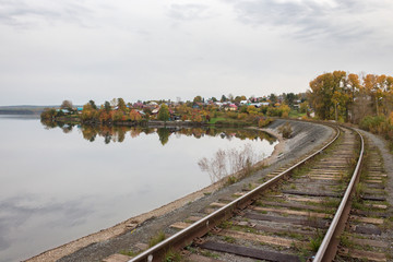 Fototapeta premium Railway and pond Bank in autumn