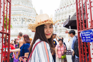 Fototapeta premium Beautiful tourist asian women travel in Wat arun buddha attractive temple white pagoda sightseeeing