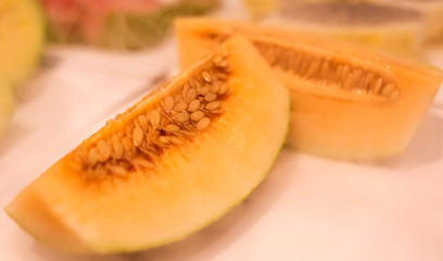 Naklejka na ściany i meble Juicy pulp with papaya seeds on the counter in the market.