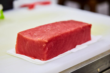 Steak of  Tuna Fish Fillet on a cutting board - Fish and Seafood