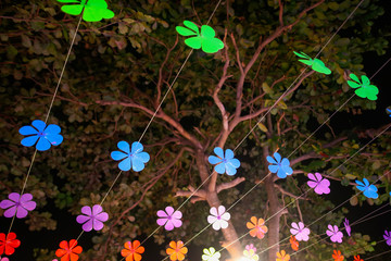 Festive decoration hang on palm trees on the nature
