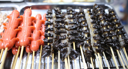 Scallops on wooden sticks for grilling.