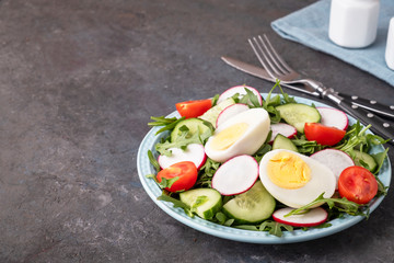 Healthy vegetables salad on a plate with space for text