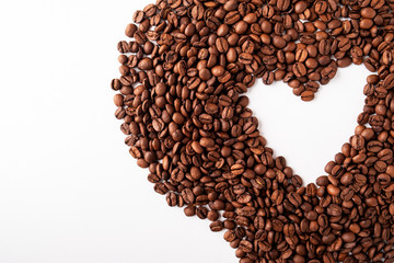 Coffee beans heart background. Copy space