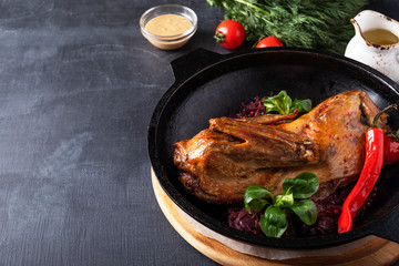 Roasted chicken with red sauerkraut. Copy space