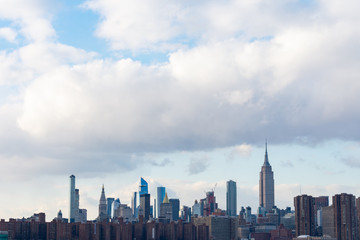 Midtown Manhattan Skyline in New York City with Clouds in the Sky