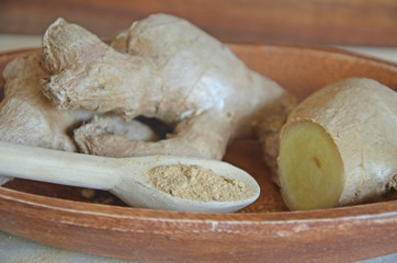 Fresh ginger in wooden bowl