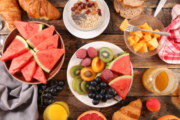 healthy breakfast with fruits, muesli and croissant