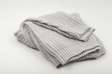 knitted gray sweater on a white background