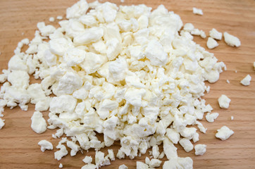 Delicious homemade cottage cheese on a wooden background. Close-up.