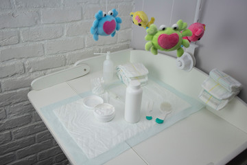 changing table and baby care products-powder, cream, pacifier, diapers