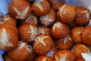 Pretzel bread rolls with salt