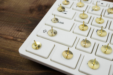 Traditional business concept. drawing pin and keyboard
