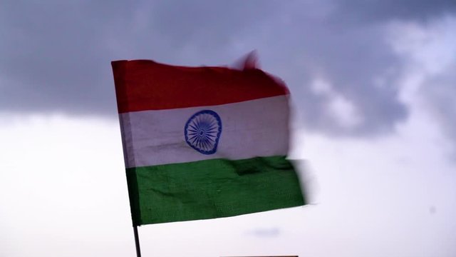 Indian tri color flag flutters in the wind in slow motion