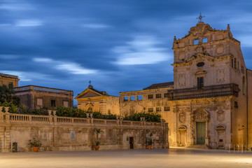 Main historic city center of Ortygia island and view of the church Santa Lucia alla Badia in Sicily...