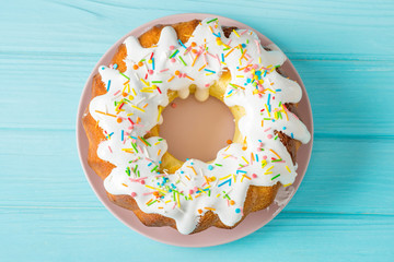 Easter cake on a blue table, easter food concept, minimalism, flat lay
