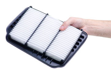 Hand holding new auto air filter on white background isolation