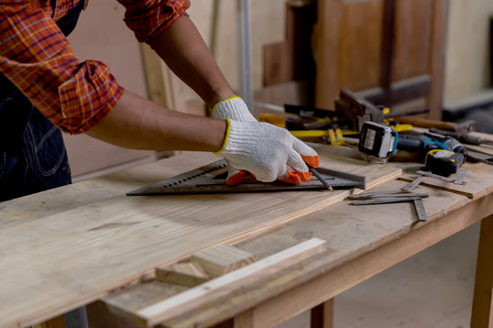 Asian Carpenter Man Work And Repair Wood Craft DIY At Home ,portrait Of Happy Attractive Hardwork Professional Worker.