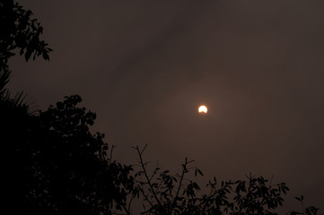 The moon covers the sun in a beautiful solar eclipse in Indian dark sky