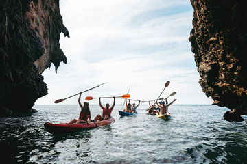 Big group of kayakers at sea bay