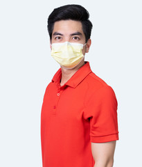 COVID-19 Coronavirus portrait handsome young asian .man wearing red shirt and mask protection from covid 19  isolated on white background in studio. Asian man people. COVID-19 concept.