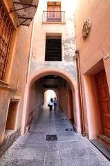 Fototapeta na wymiar Via del Fossario, characteristic street of the Castello district in Cagliari. Sardinia, Italy
