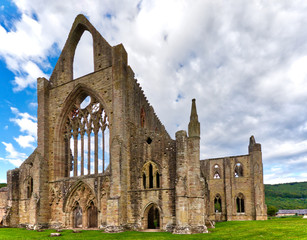Fototapeta premium The ruins of Tintern Abbey, founded by Walter de Clare, Lord of Chepstow, on 9 May 1131. It is situated adjacent to the village of Tintern in Monmouthshire, Wales, UK.