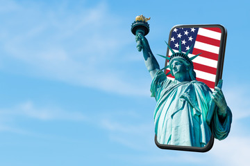 Smartphone pop up for advertising.The Statue of Liberty through screen moblie with USA Flag background on screen and blue sky.Application or E-Visa app information.Digital marketing online cencept. © ChayTee