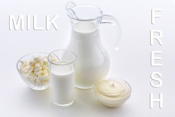 Fresh milk on a white background. Cottage cheese, Milk, Sour cream, fresh products. Fresh sour cream and cottage cheese along with useful goat's milk. Dairy products support bone health. 