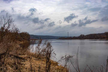 View of the Oka River in Russia in the spring in cloudy weather, beautiful river landscape.