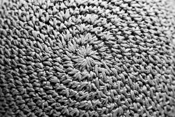 braided hat. texture. background. Black and white photo