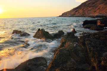Rock and stone on the sunset at Khao Leam Ya ,Rayong Thailand,Amazing beach sunset. Long Exposure.
