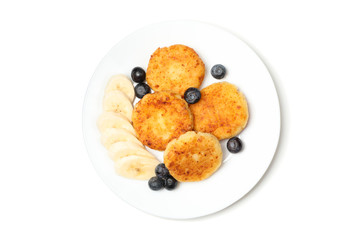 Plate with delicious cheese pancakes isolated on white background