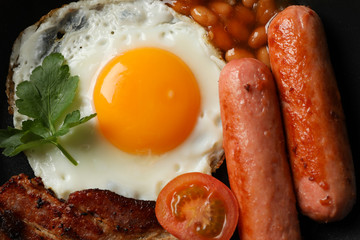 Delicious breakfast or lunch with fried eggs on whole background, close up